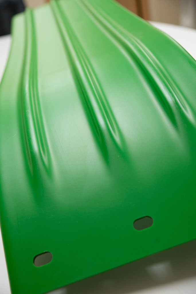 Polyethylene aftermarket grain tank extension panel.