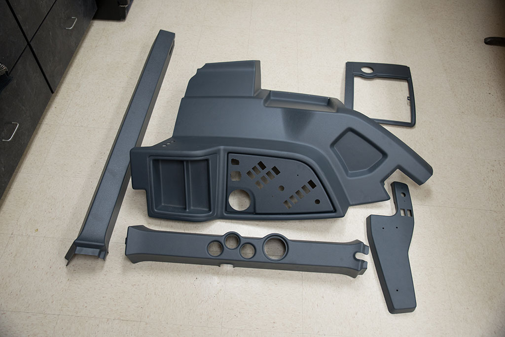 Thermoformed cab interior pieces before assembled.