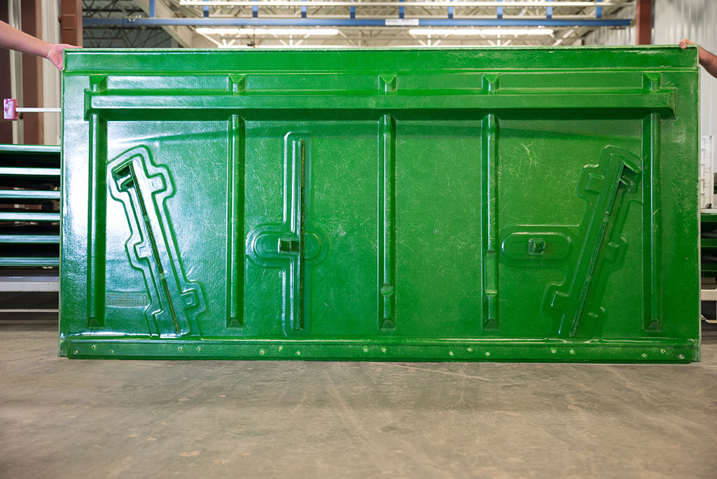 Grain tank extension panel made with our patented TEC process which can incorporate steel brackets and foam for structure.