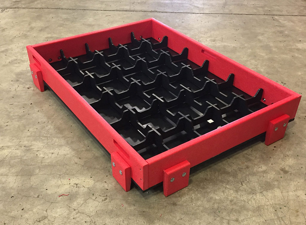 Custom material handling trays with removable dividers.