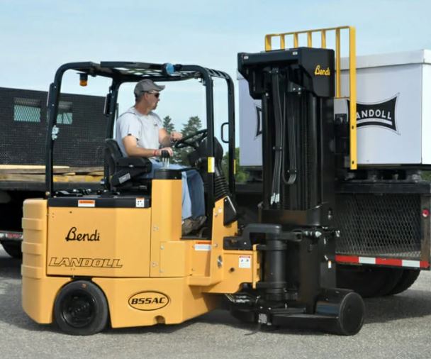 Thermoformed black textured protective cover on a Landoll fork lift.