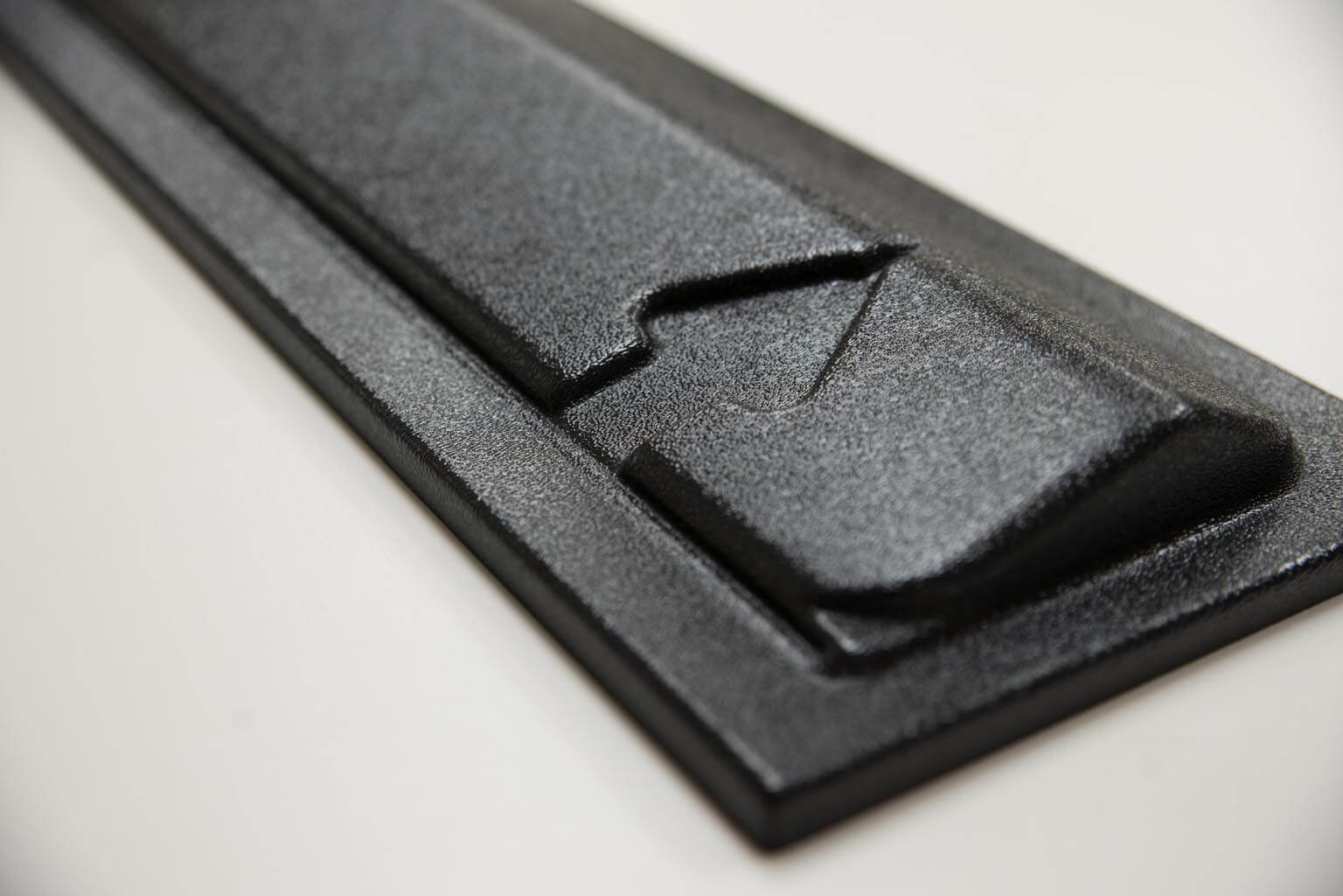Color matched black textured ABS plastic door for a vending machine.
