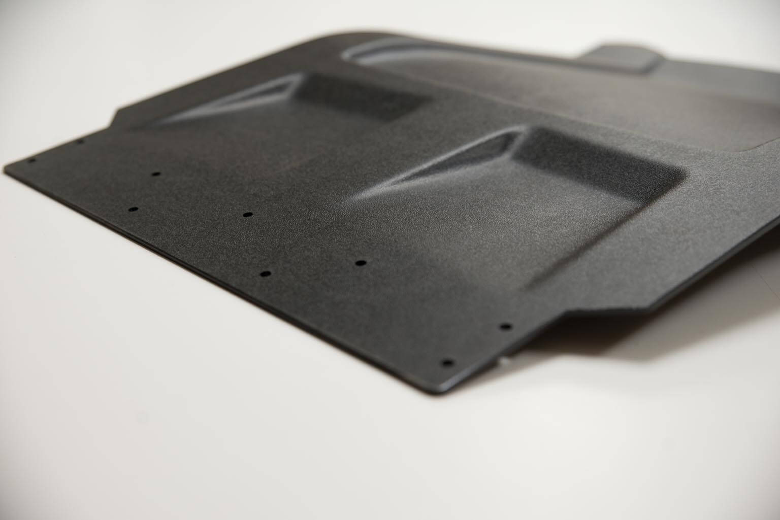 Vacuum forming polyethene snow flap for a Polaris snowmobile.