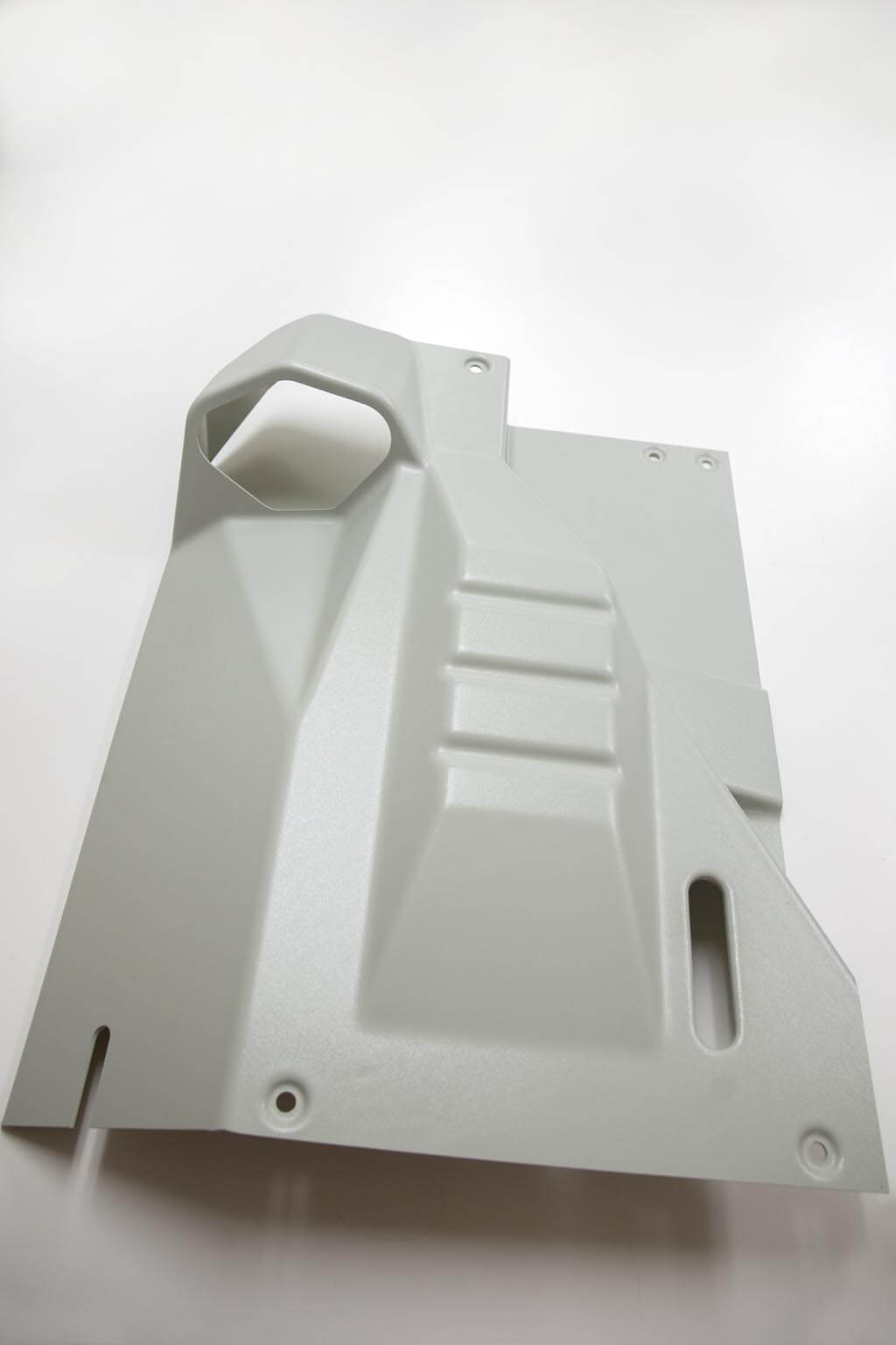 Color matched textured ABS plastic part.